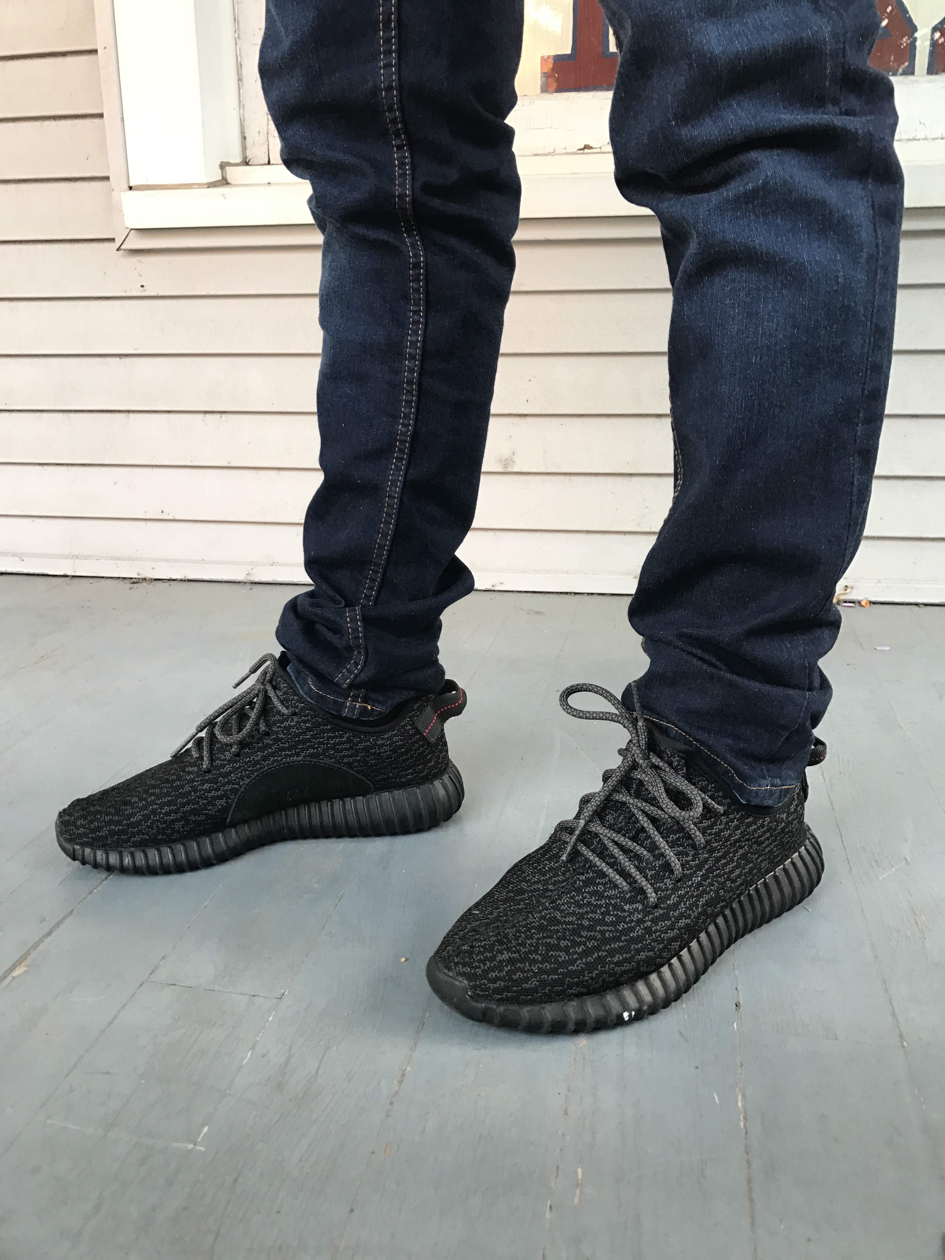 yeezys black with red writing